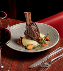 Elegant dining with lamb shank and wine at River Island Hotel, Kerry.