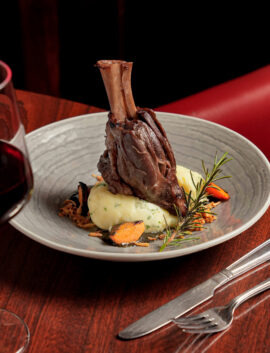 Elegant dining with lamb shank and wine at River Island Hotel, Kerry.