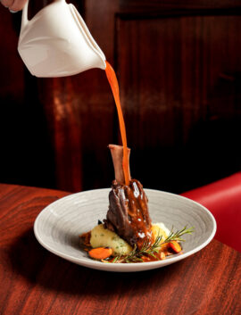 Succulent lamb shank with rosemary sauce at River Island Hotel restaurant.