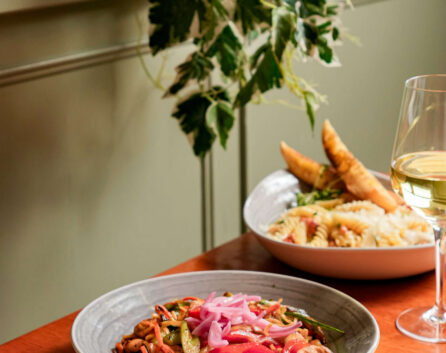 Delicious meal with wine at River Island Hotel's restaurant, inviting and cosy setting.