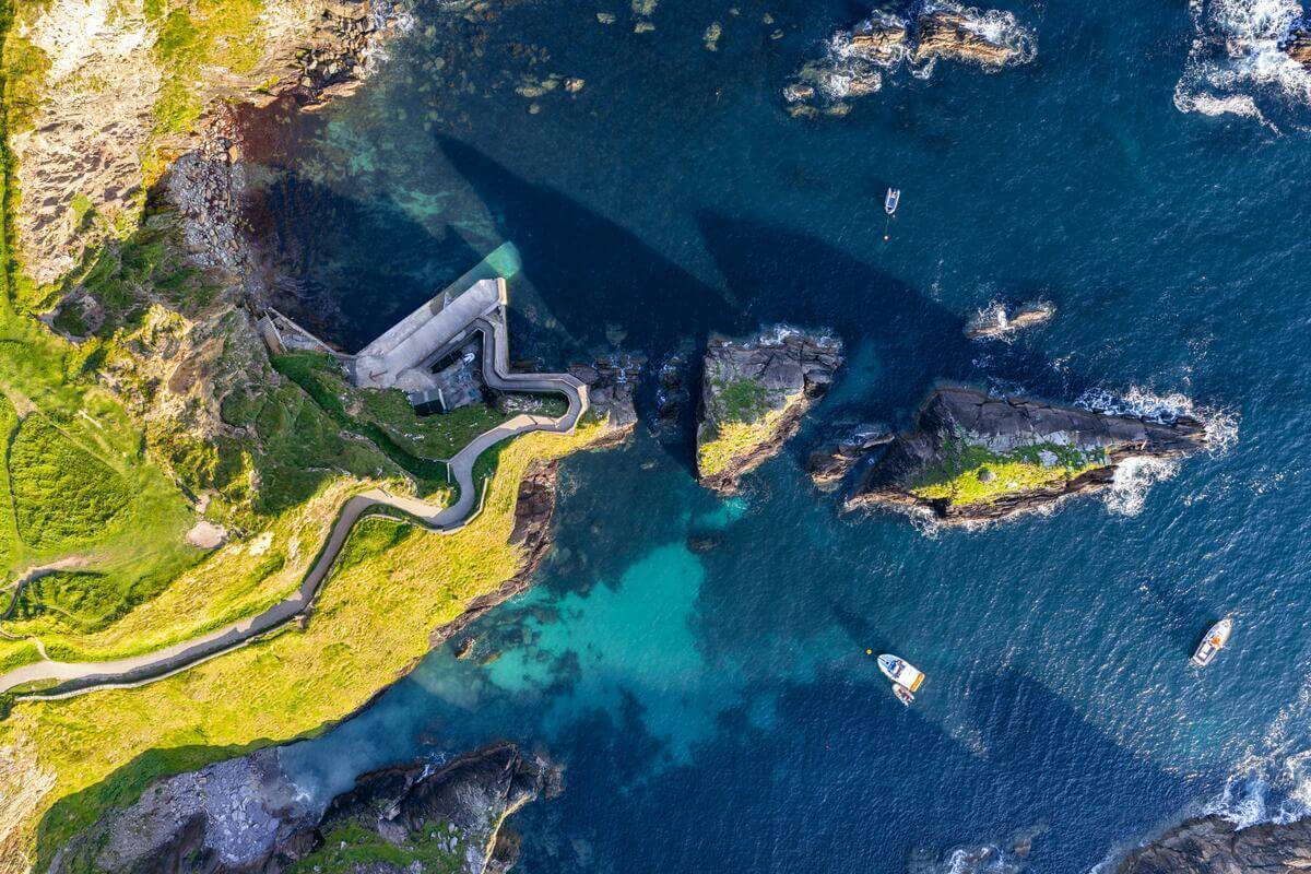 Aerial view of vibrant coastline near River Island Hotel, ideal for exploring.