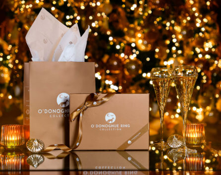 Festive gift boxes and candles in front of a Christmas tree at River Island Hotel