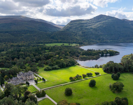 Family enjoying picnic with view of lush landscape near River Island Hotel in Kerry.