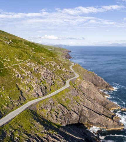 Family exploring scenic Ring of Kerry coastline near River Island Hotel