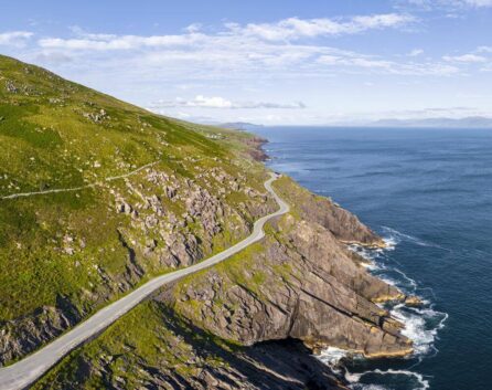 Family exploring scenic Ring of Kerry coastline near River Island Hotel