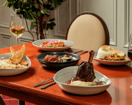 Elegant dining with gourmet dishes and wine at River Island Hotel restaurant.