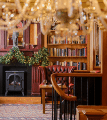 Cosy hotel lounge with leather armchairs and fireplace