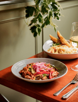 Delicious plated meals and wine in a cosy River Island Hotel restaurant setting.