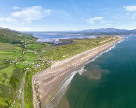 Scenic aerial view of beach and coastline near River Island Hotel, ideal for family excursions.