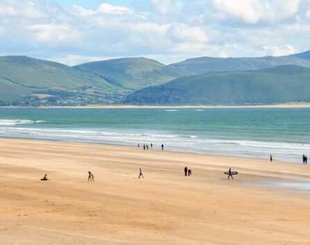 Families enjoying a sunny day on a spacious beach near River Island Hotel in Kerry.