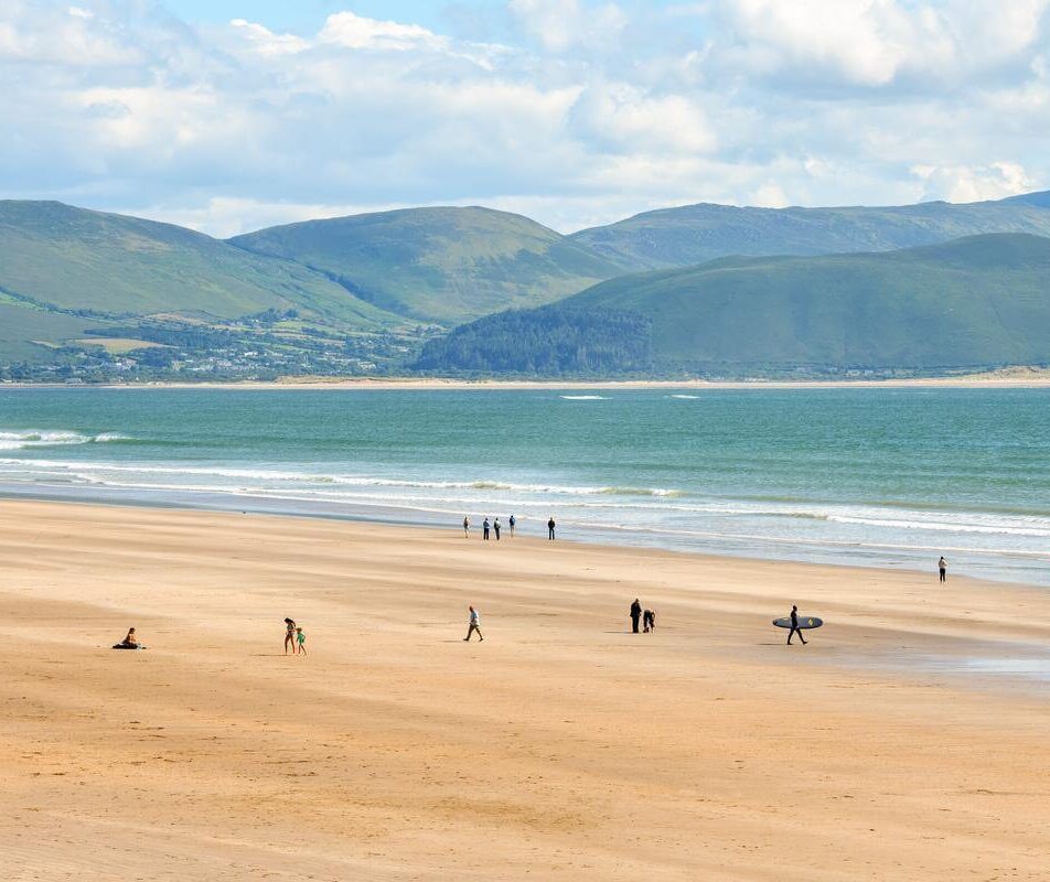 Families enjoying a sunny day on a spacious beach near River Island Hotel in Kerry.