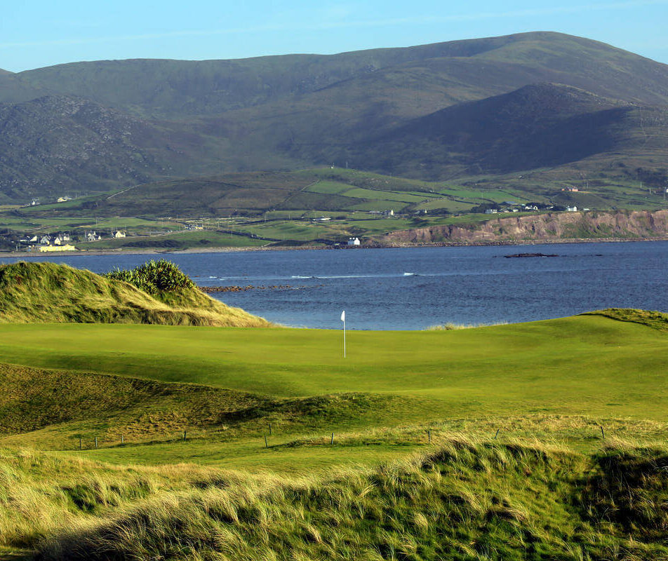 Family enjoying a sunny day on a golf course by the sea in Kerry near River Island Hotel.