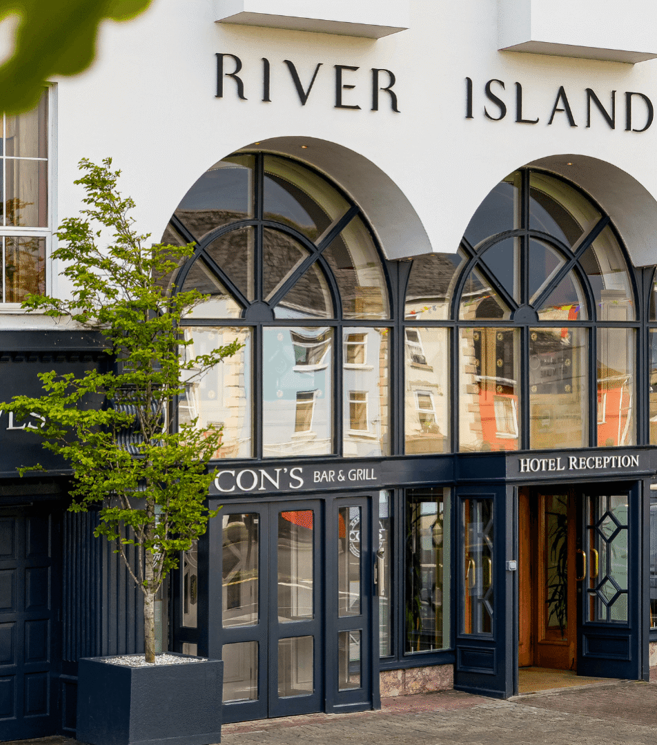 Elegant facade of River Island Hotel with welcoming entrance.