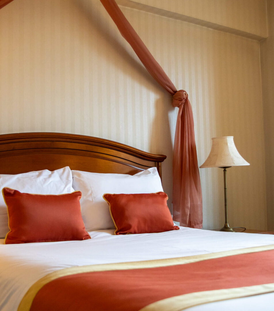 Cosy hotel room with elegant bedding, warm lighting, ideal for families or couples.