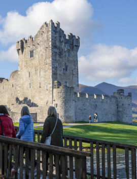 Family enjoying a scenic view of a castle near River Island Hotel, Kerry.